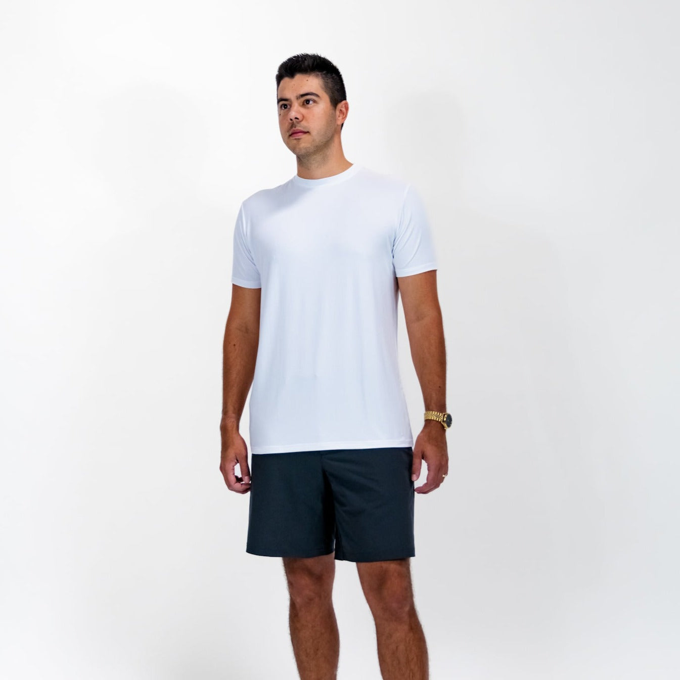 Pillar Athletics Leo White Tee on male model, showcasing tailored fit and breathable fabric.