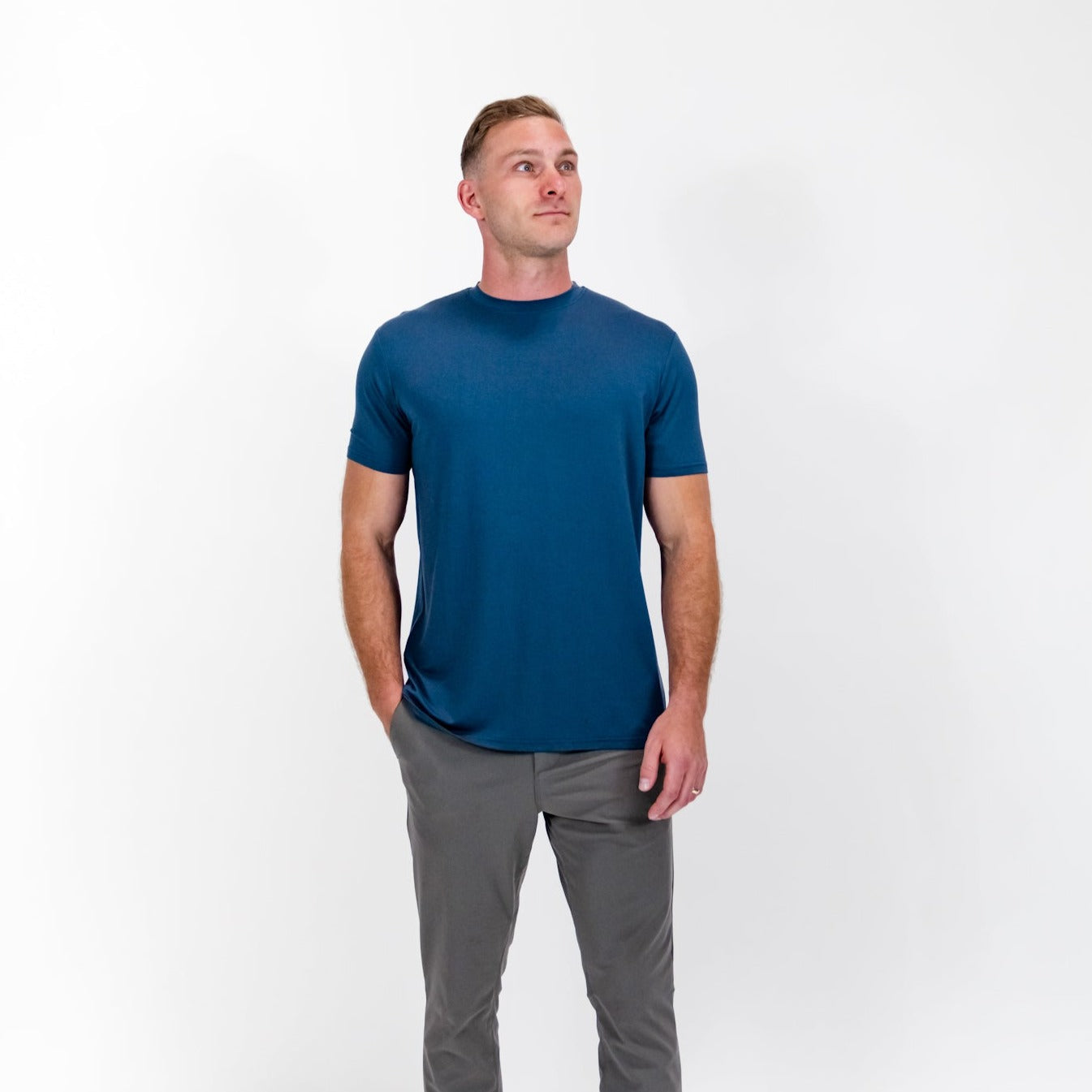 Pillar Athletics Leo Navy Tee on model, showcasing breathable and stretchy fabric for athletic and everyday wear.