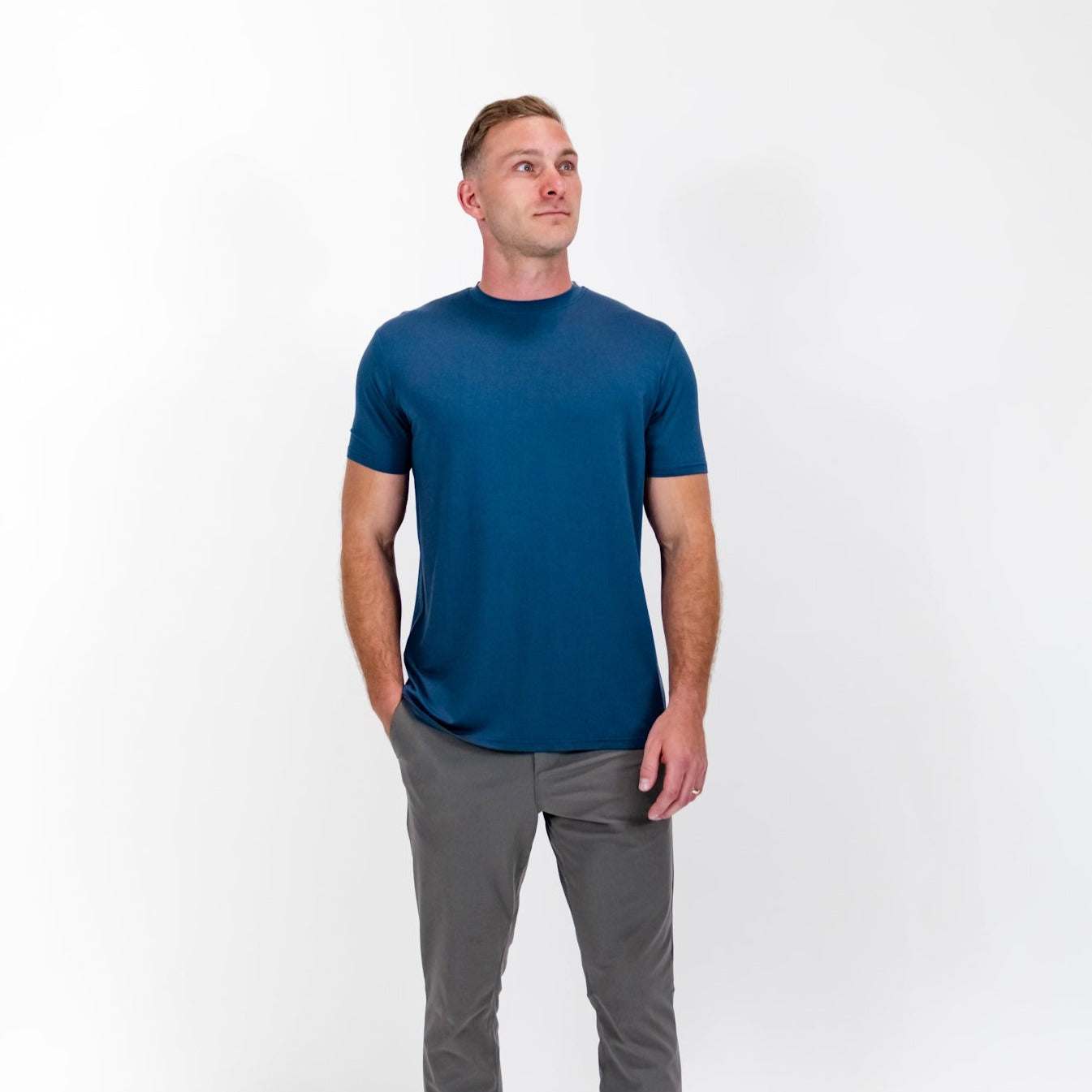 Pillar Athletics Leo Navy Tee on model, showcasing breathable and stretchy fabric for athletic and everyday wear.