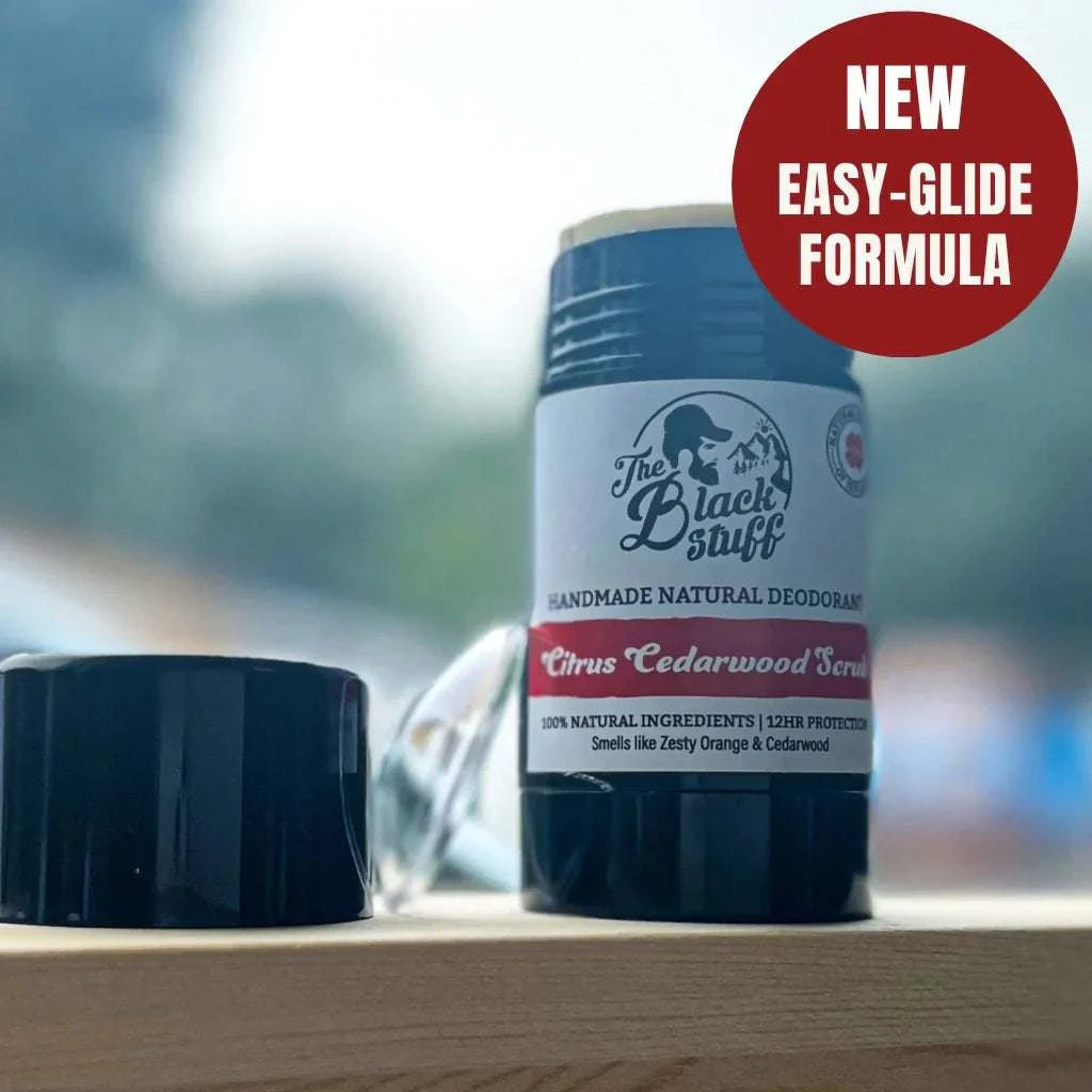Citrus Cedarwood Blast natural deodorant with new easy-glide formula on a wooden surface.