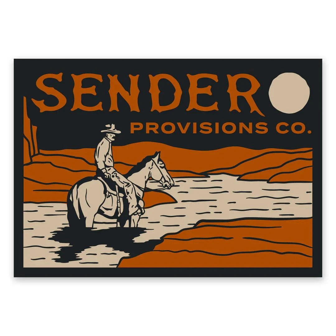 Vinyl die-cut matte sticker featuring a lone rider on horseback crossing a river under the moon, with "Sendero Provisions Co." text.
