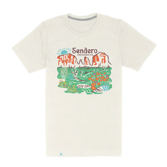 Sendero Desert Bloom Tee featuring desert landscape with bright colors, made from organic cotton blend.