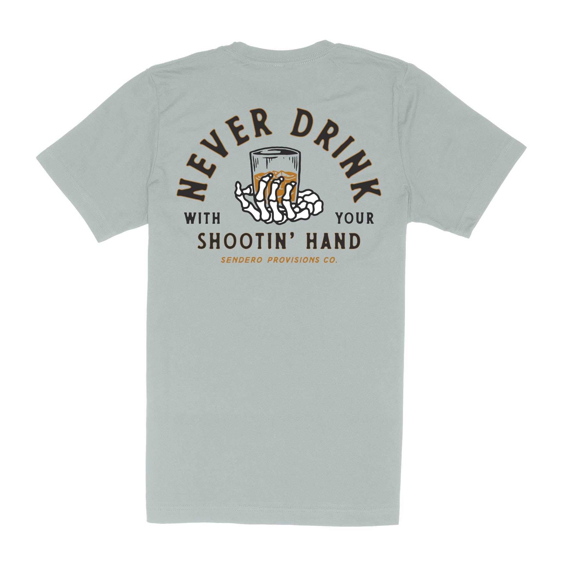 Sendero Shootin Hand T-Shirt Big Sky Blue with Never Drink with Your Shootin' Hand graphic and skeleton hand holding a glass